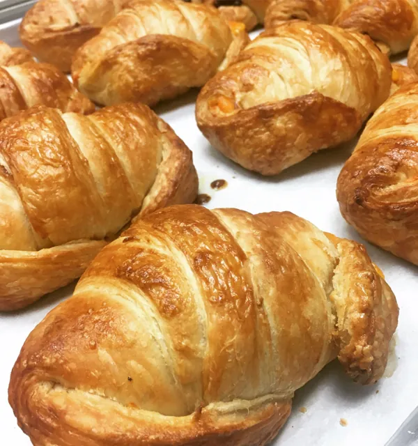 Golden butter croissants on a tray