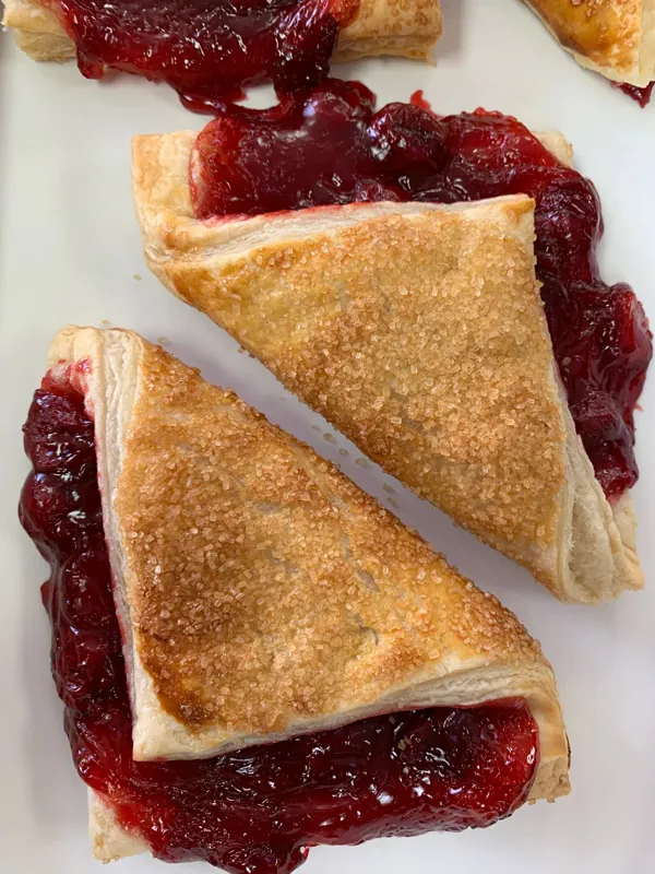 Cherry turnovers with sugar crust